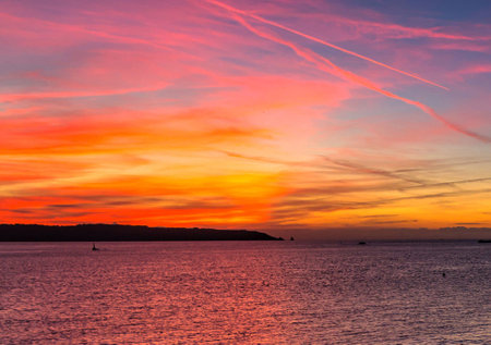 Beautiful sunset over the sea in the evening. Colorful sky.の写真素材