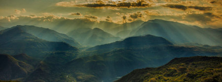 Sunset in the mountains. Panoramic view of the mountains.