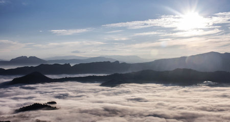 Panoramic view of the misty mountains in the morning.の写真素材