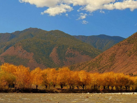 Landscape of the river and the mountains in the autumn season.