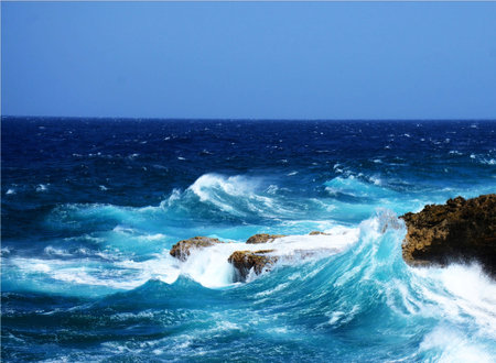 Waves breaking on the rocky coast of the island of Crete