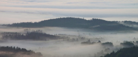 Panoramic view of foggy morning in the Carpathian mountains