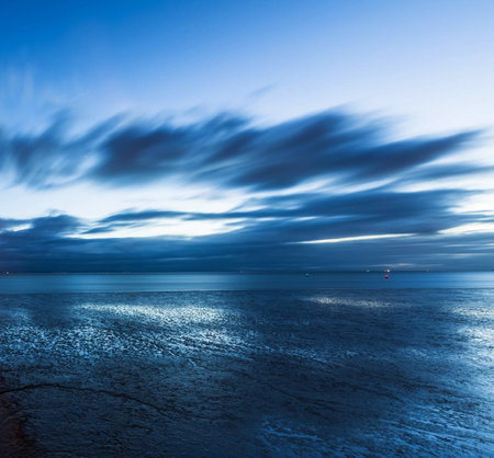 beautiful seascape with blue sky and clouds, long exposureの写真素材