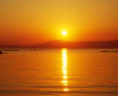 Beautiful sunset over the sea. Sunset over the sea. Beautiful orange sunset over the sea.の写真素材