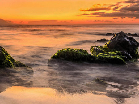Beautiful sunset at the beach in the tropics. Toned.