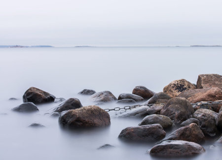 Coastline of the Baltic Sea with stones in the water.の写真素材