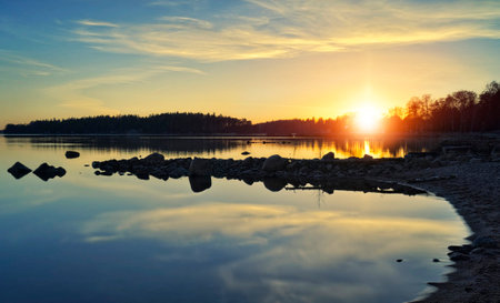 Sunset over the lake. Russia, Vologda region.の写真素材