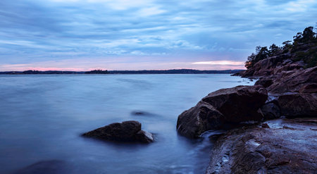 Long exposure seascape with rocks at sunset. Long exposure.の写真素材