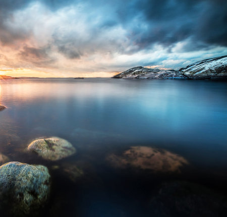 Beautiful sunset over fjord in Norway. Long exposure.の写真素材