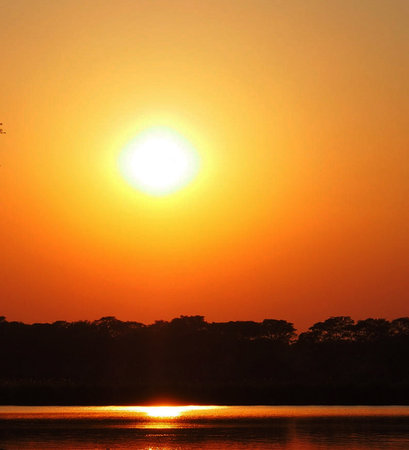Sunset over the lake in Chobe National Park, Botswanaの写真素材