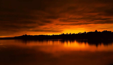 Sunset at the lake with reflection in the water, Thailand.の写真素材