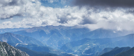 Panoramic view of the mountains and clouds in the valley.の写真素材