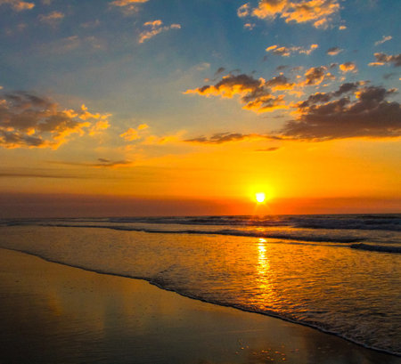 Sunset at the beach in Bali, Indonesia. Beautiful seascape.の写真素材