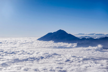 Above the clouds on the peak of Mount Rinjani, Lombok, Indonesiaの写真素材