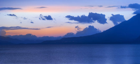 Beautiful sunset over Lake Atitlan, Guatemala, Central Americaの写真素材