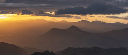 Sunset over the mountain range. Panoramic view of the mountains at sunsetの写真素材