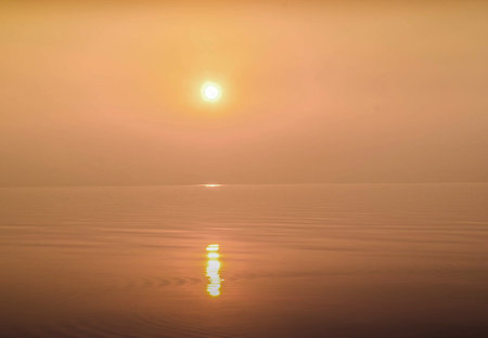 Sunset on the sea. Beautiful sunset on the sea. The sun is reflected in the water.の写真素材