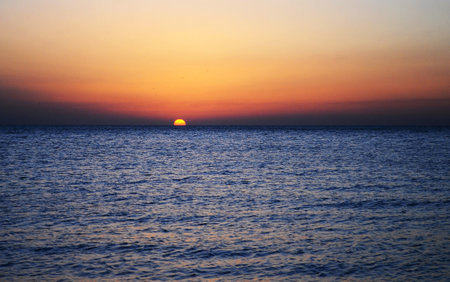 Sunset over the sea. Sunset over the sea. Beautiful sunset over the sea.の写真素材