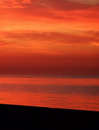 Beautiful sunset over the sea. The sun sets over the sea.の写真素材