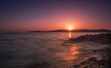 Sunset on the beach in Ibiza, Balearic Islands, Spainの写真素材