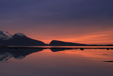 Sunset over the sea and mountains in the background, Svalbard, Norwayの写真素材