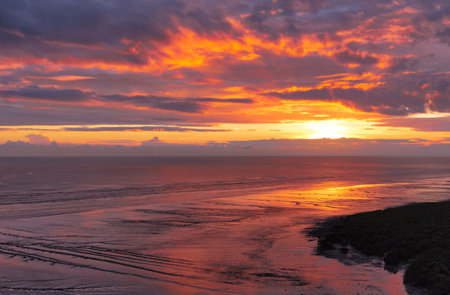 Sunset on the beach of the Baltic Sea in Kolobrzeg, Polandの写真素材