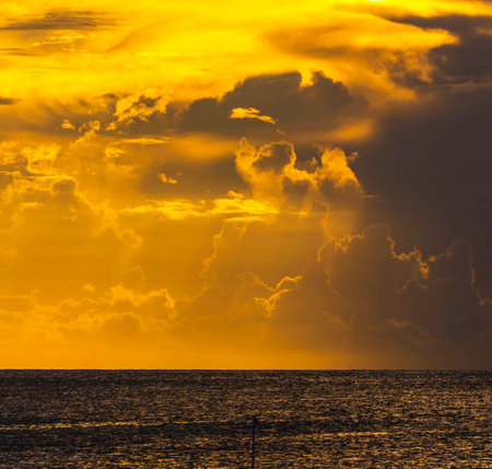 Sunset over the sea with dramatic clouds in the sky. Toned.の写真素材