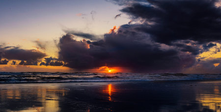 Beautiful sunset on the beach. Dramatic sky over sea.