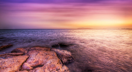 Beautiful sunset over the sea. Long exposure. Toned.の写真素材