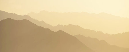 Silhouette of mountains at sunset, panoramic view.の写真素材