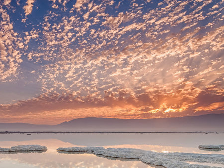 Sunset over the Dead Sea in Israel with clouds in the skyの写真素材