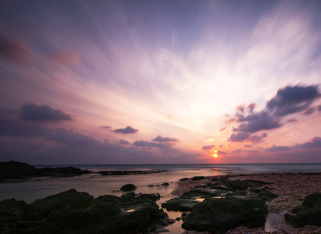 Beautiful sunset on the beach at Khao Lak, Thailand.の写真素材