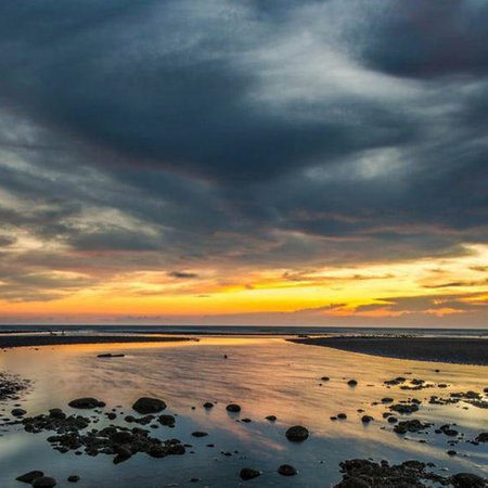 Sunset on the beach at low tide in the evening,Thailandの写真素材