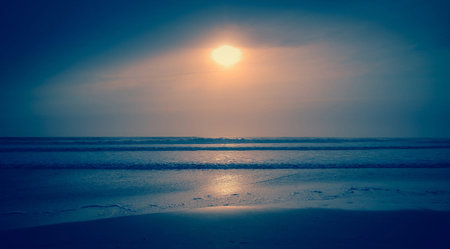 Beautiful sunset on the beach.Vintage filter.selective focus.の写真素材