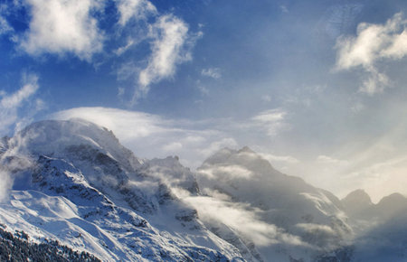 Winter mountains in the clouds. Caucasus, Dombay, Russiaの写真素材