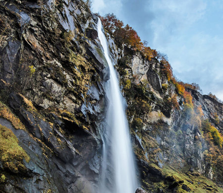 Autumn landscape with a waterfall in the Caucasus mountains, Georgia.