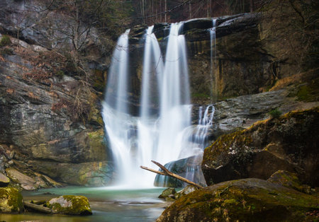 Waterfall in the forest, long exposure, wide angle view.