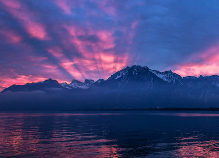 Sunset over Lake Lucerne, Switzerland, with mountains in the backgroundの写真素材