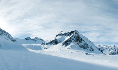 Mountains in the French Alps in winter. Panoramic view.