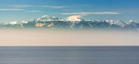 Panoramic view of the snow-capped mountains and the sea
