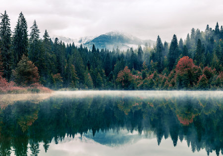 Autumn alpine lake with reflection of the mountains in the waterの写真素材