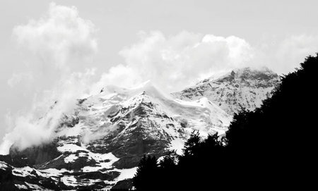 Black and white photo of the snow covered mountains in Himalayas