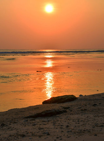 Sunset on the beach of the Indian Ocean, Goa, Indiaの写真素材