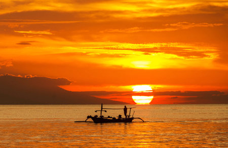 Silhouette of fisherman boat at sunset in Koh Samui, Thailand