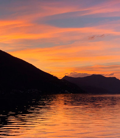 Sunset at Lake Como, Italy. View from the shore.の写真素材