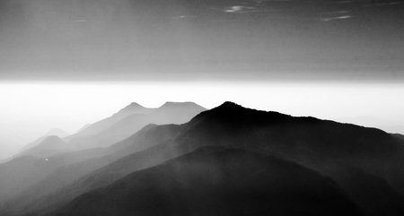 Black and white image of the mountain range in the early morning.の写真素材