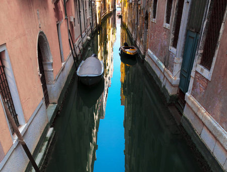 Venice canal with gondolas in the morning. Italy.の写真素材