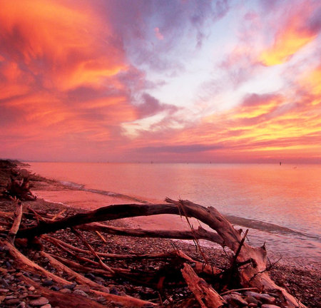 Beautiful sunset on the beach. Colorful sky at sunset.の写真素材