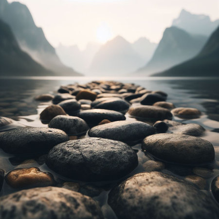 Pebbles on the shore of a mountain lake in misty morningの素材
