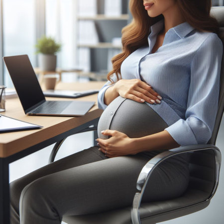 cropped view of pregnant businesswoman sitting in armchair at workplaceの素材